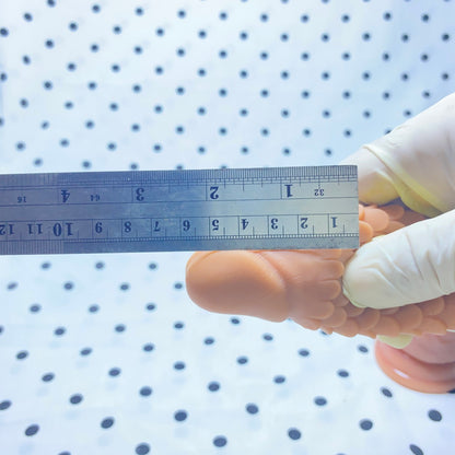 Sakura Fini Dragon Scale Condom - Increased size and thickness with large, spiked particles.