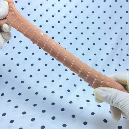 Sakura Fini Dragon Scale Condom - Increased size and thickness with large, spiked particles.